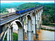 Long heavy axle load bulk mineral train needs easy gradients, tolerates tight curves